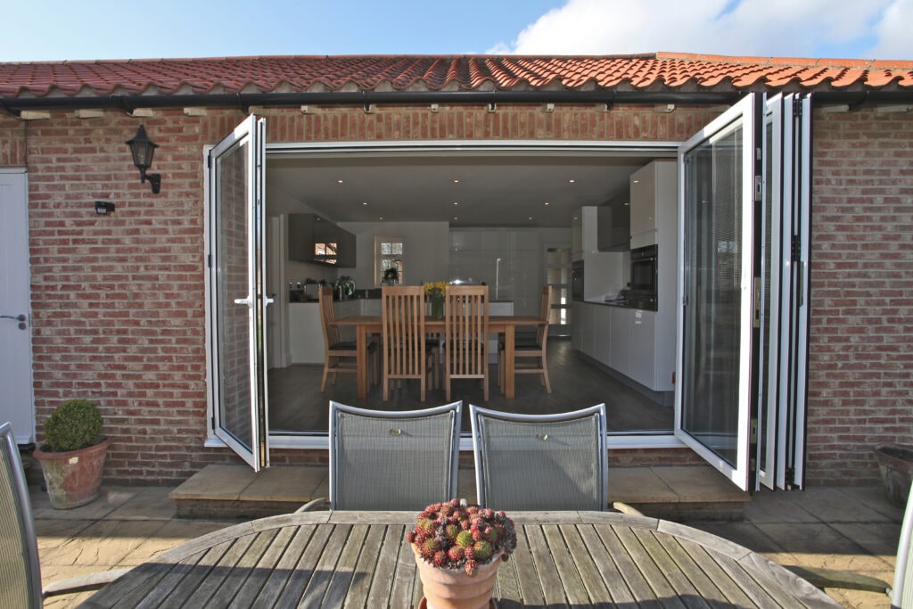 buying new bifold doors showing a fitted door in a new house extension