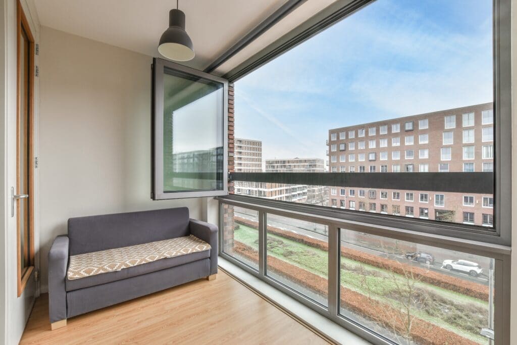 bifold windows on a balcony in a high level flat